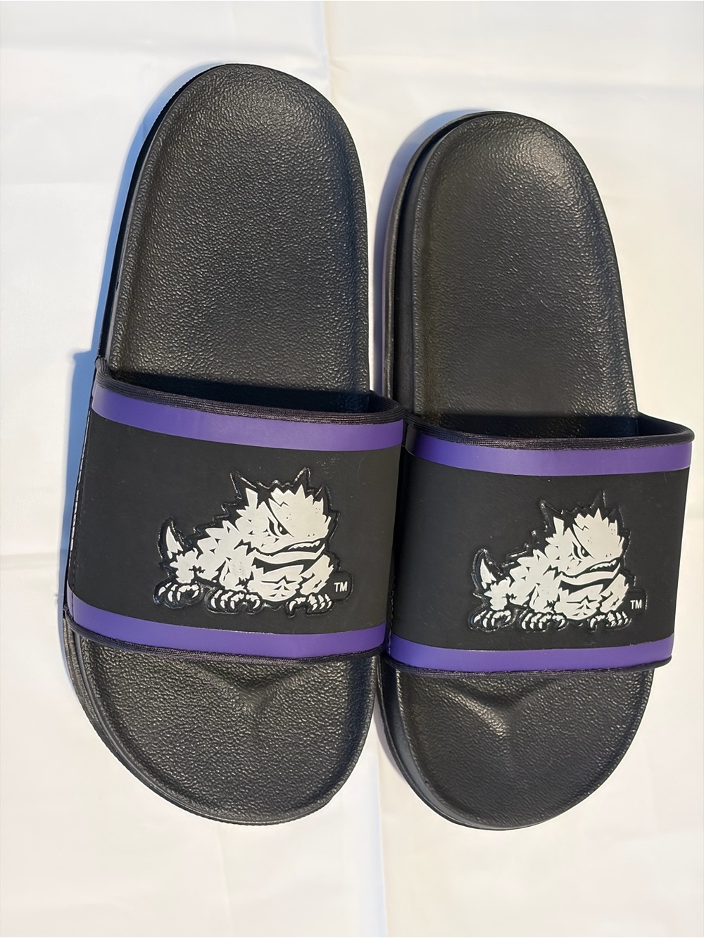 Nike Black Slide Sandals with Purple Trim and White Monster Graphic
